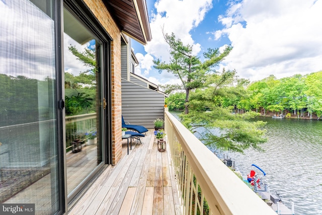 balcony featuring a water view