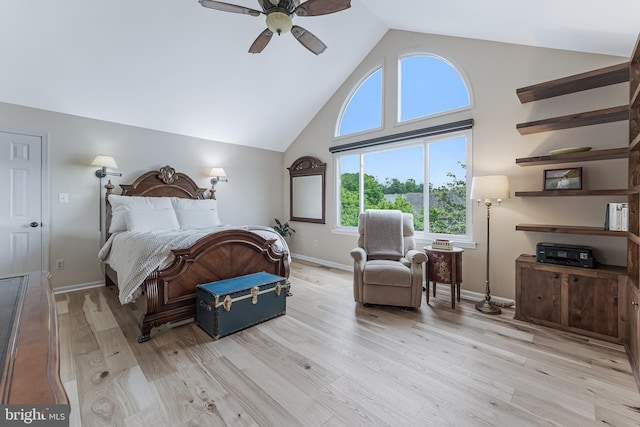 bedroom featuring high vaulted ceiling, light wood-style floors, baseboards, and ceiling fan