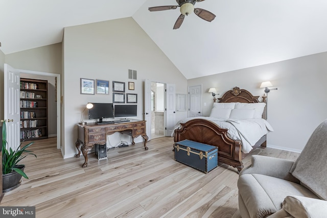 bedroom featuring high vaulted ceiling, wood finished floors, connected bathroom, a ceiling fan, and baseboards