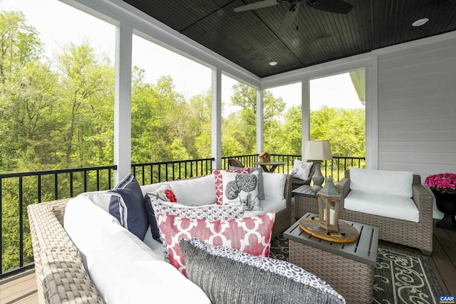 sunroom with a ceiling fan, outdoor lounge area, and plenty of natural light