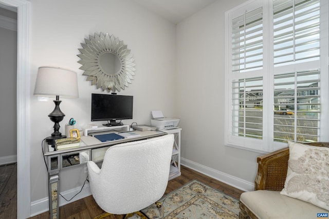 office featuring baseboards, wood finished floors, and a wealth of natural light