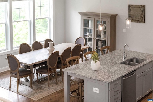 dining area featuring dark wood-style flooring