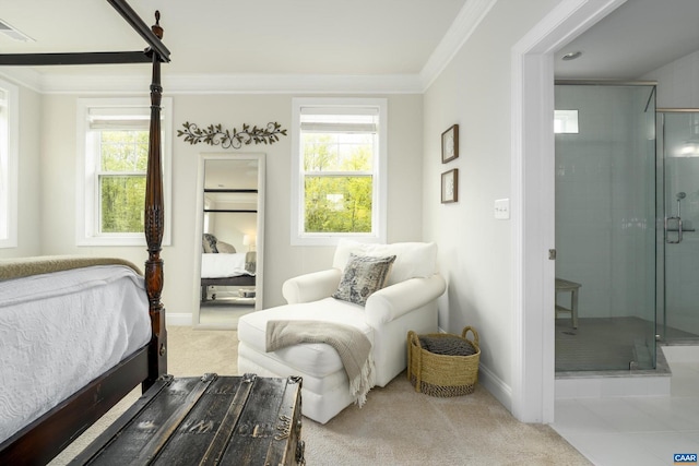 carpeted bedroom featuring baseboards, ornamental molding, and visible vents
