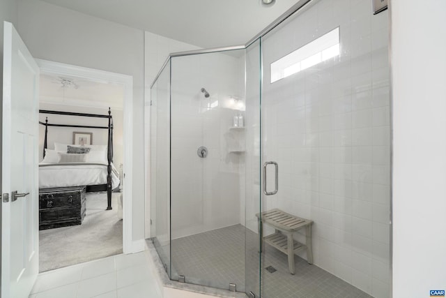 full bathroom with tile patterned floors, a shower stall, and ensuite bath