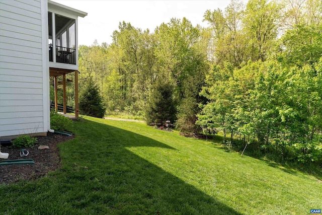 view of yard featuring a sunroom