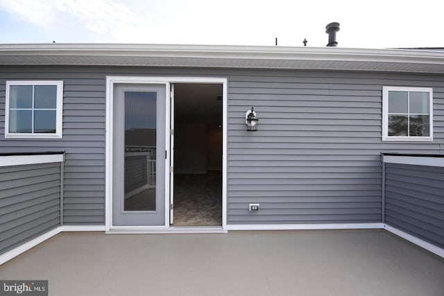 property entrance with a patio area