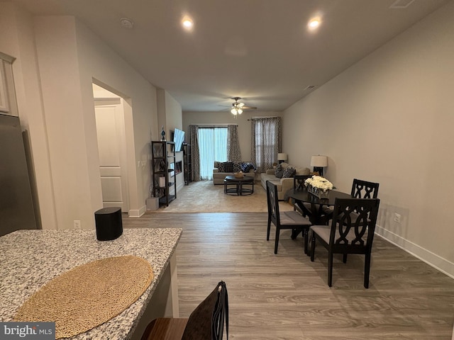 dining area with recessed lighting, ceiling fan, wood finished floors, and baseboards