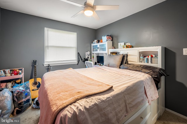bedroom featuring a ceiling fan, carpet floors, and baseboards