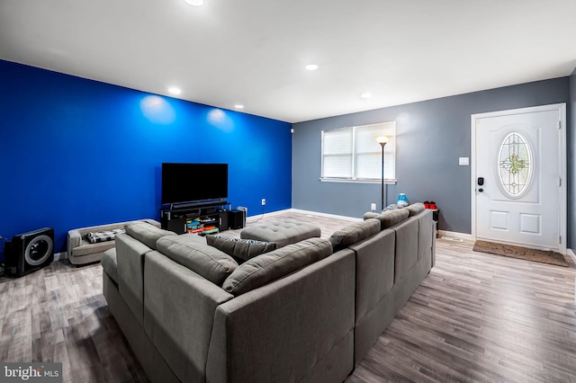 living area with recessed lighting, wood finished floors, and baseboards