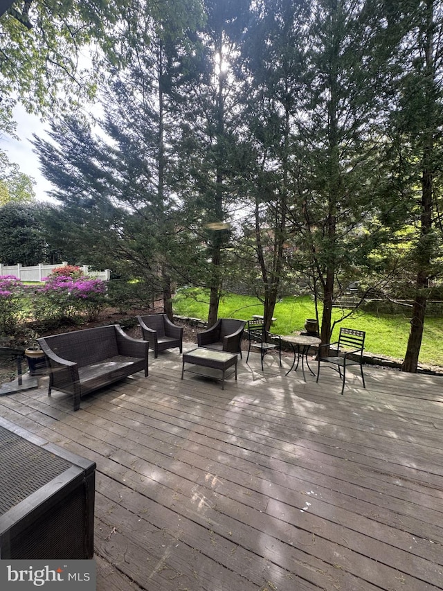 wooden deck featuring outdoor lounge area