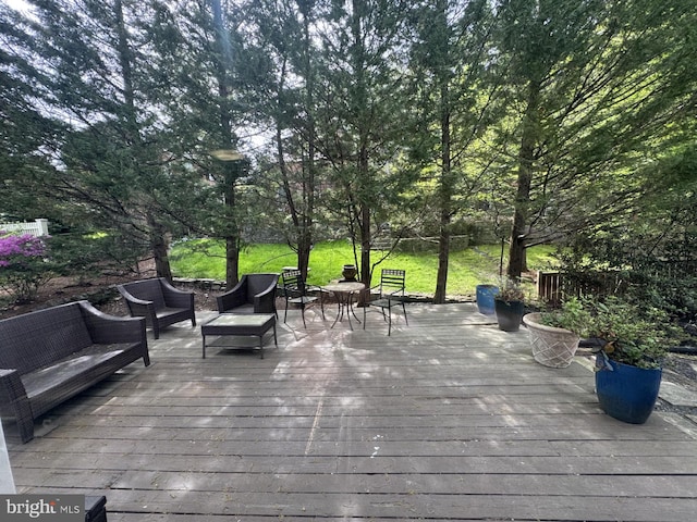 wooden deck featuring outdoor lounge area