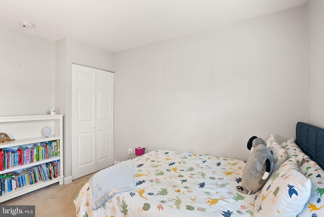 carpeted bedroom featuring a closet
