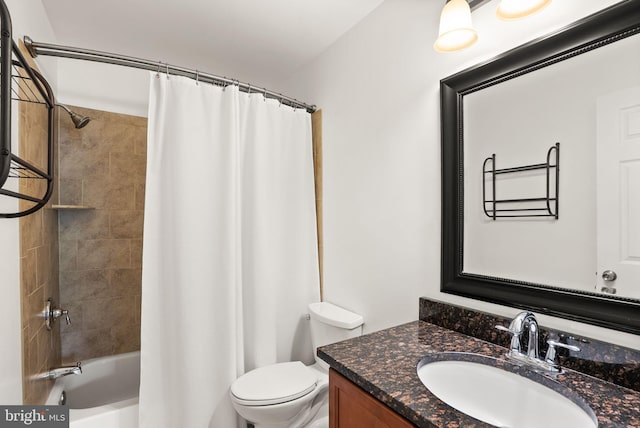 bathroom with toilet, shower / bath combo with shower curtain, and vanity