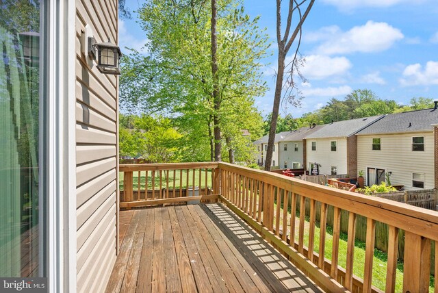 wooden terrace featuring a residential view
