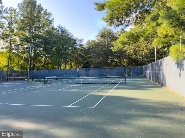 view of sport court with fence