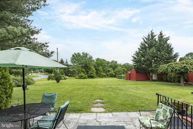 1085 Greenwood Rd, Winchester, VA 22602 - view of grassy yard featuring a patio and an outdoor structure