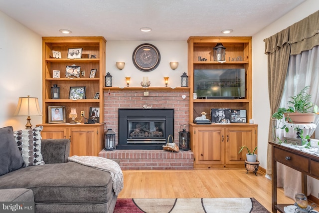 1085 Greenwood Rd, Winchester, VA 22602 - living room featuring wood finished floors, a fireplace, and recessed lighting