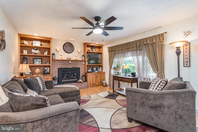 1085 Greenwood Rd, Winchester, VA 22602 - living area with light wood finished floors, ceiling fan, a brick fireplace, and recessed lighting