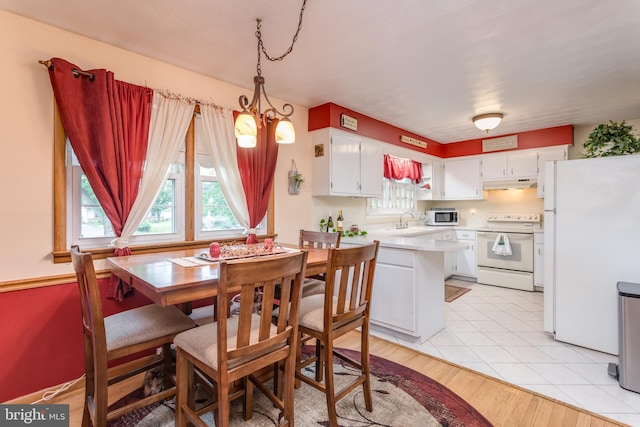1085 Greenwood Rd, Winchester, VA 22602 - dining area featuring a chandelier and light tile patterned floors
