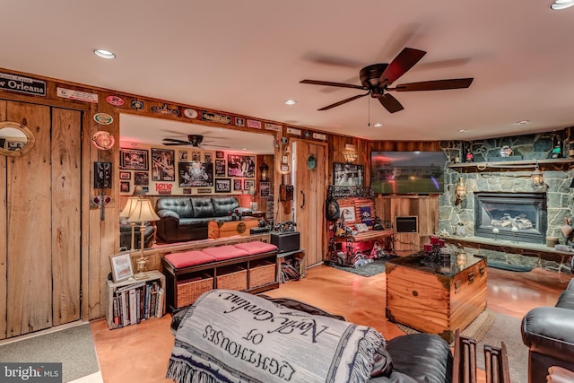 1085 Greenwood Rd, Winchester, VA 22602 - living area featuring ceiling fan, a stone fireplace, wood walls, and recessed lighting
