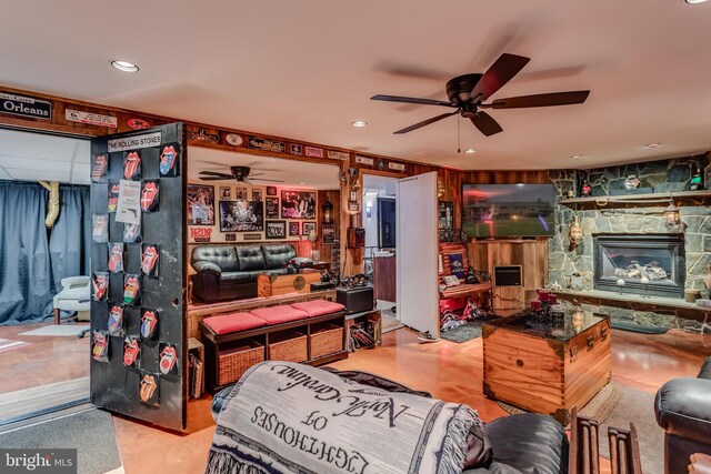 1085 Greenwood Rd, Winchester, VA 22602 - living room featuring a ceiling fan, a stone fireplace, and recessed lighting