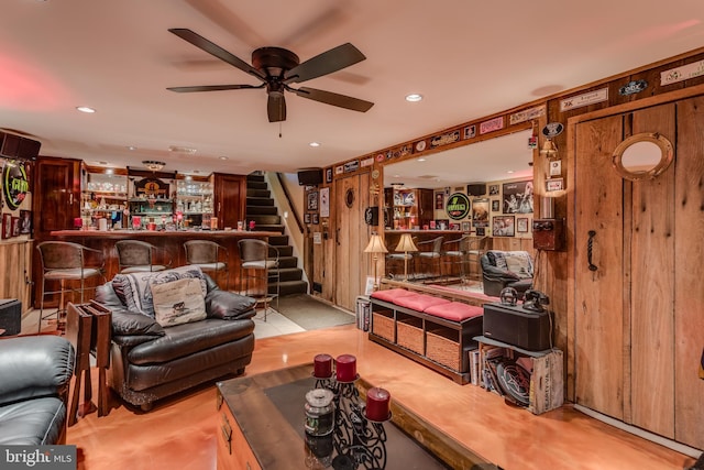 1085 Greenwood Rd, Winchester, VA 22602 - living room featuring a bar, a ceiling fan, stairway, and recessed lighting
