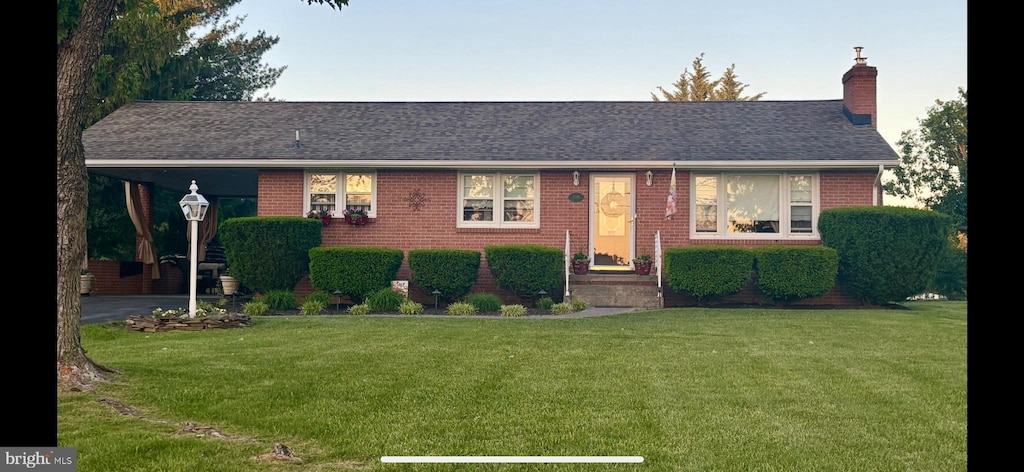 1085 Greenwood Rd, Winchester, VA 22602 - ranch-style house with a front yard, brick siding, a chimney, and a shingled roof