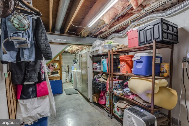 1085 Greenwood Rd, Winchester, VA 22602 - unfinished below grade area featuring washer and clothes dryer and freestanding refrigerator