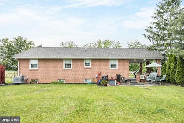 1085 Greenwood Rd, Winchester, VA 22602 - back of house featuring a yard, central air condition unit, a patio area, and brick siding