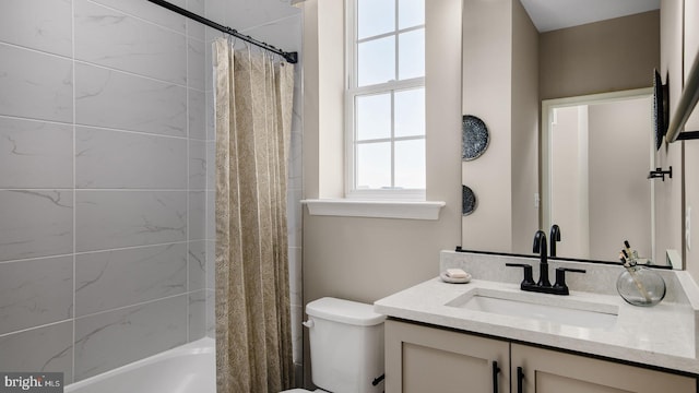 full bath with toilet, vanity, and shower / tub combo