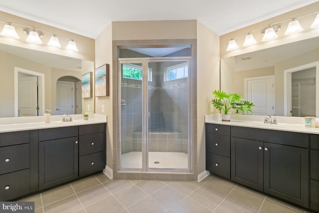 6725 Accipiter Dr, New Market, MD 21774 - bathroom with tile patterned flooring, a shower stall, two vanities, and a sink