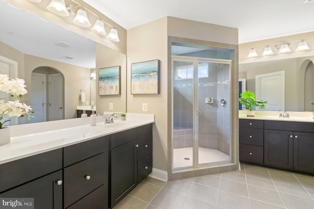 6725 Accipiter Dr, New Market, MD 21774 - bathroom with tile patterned floors, a stall shower, two vanities, and a sink