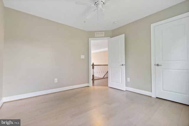 6725 Accipiter Dr, New Market, MD 21774 - unfurnished bedroom featuring light wood finished floors, baseboards, ceiling fan, and visible vents