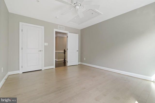 6725 Accipiter Dr, New Market, MD 21774 - spare room featuring attic access, visible vents, baseboards, ceiling fan, and light wood-style floors