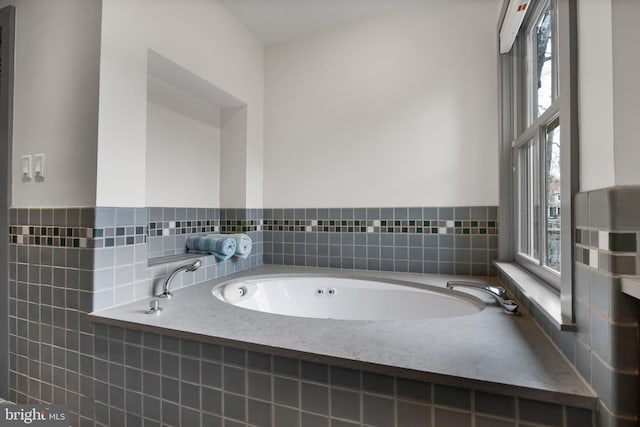 bathroom with a garden tub