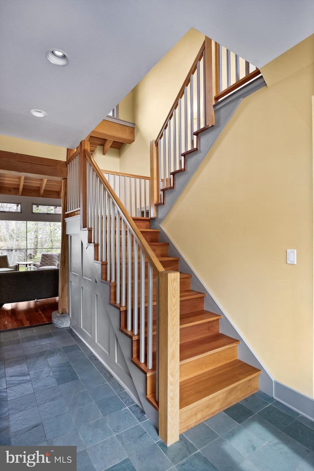 stairway with baseboards and recessed lighting
