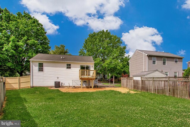 1603 Norwich Dr, Frederick, MD 21701 - rear view of property featuring a wooden deck and central AC