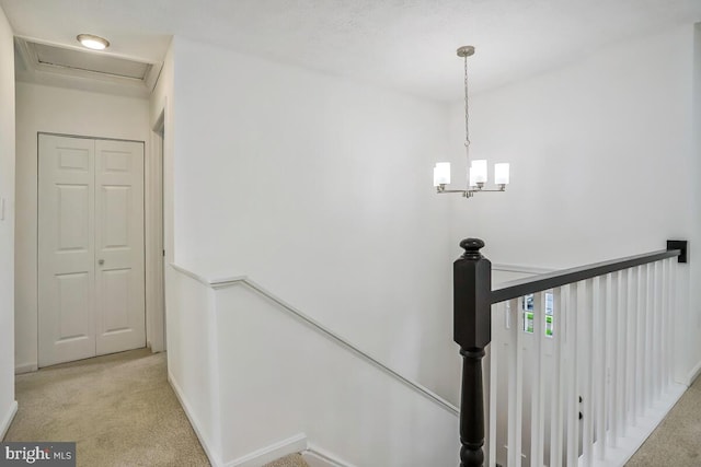 1603 Norwich Dr, Frederick, MD 21701 - hallway featuring an upstairs landing, light colored carpet, a chandelier, and baseboards