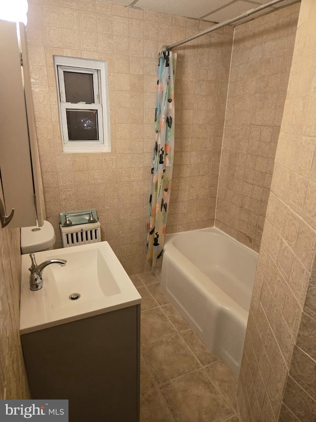 full bathroom featuring shower / tub combo with curtain, tile patterned flooring, and vanity