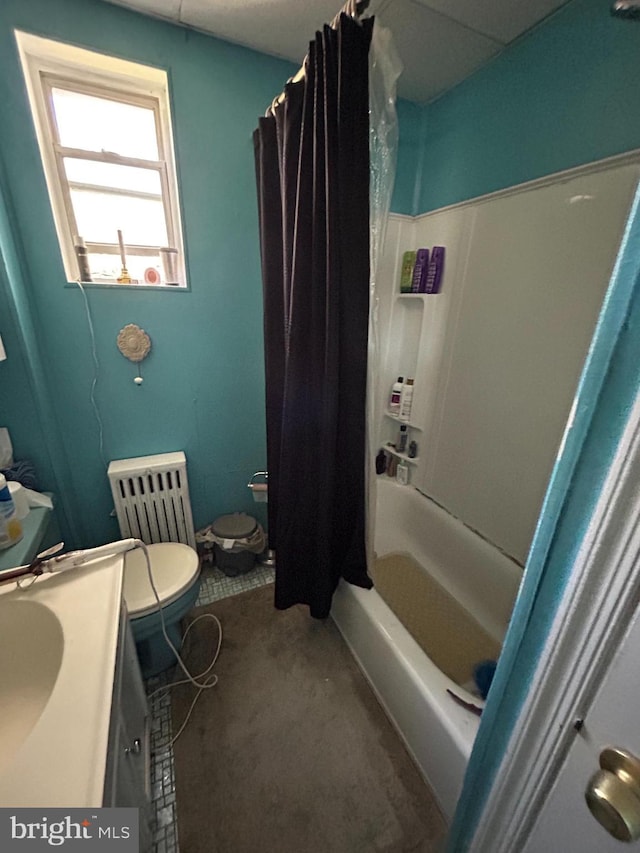 bathroom featuring shower / bath combo, vanity, and toilet