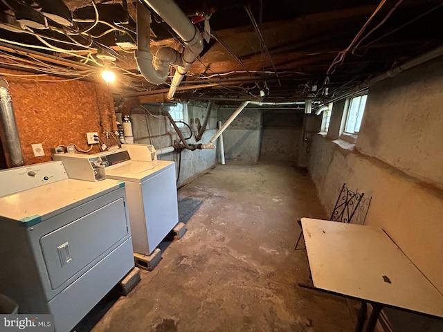 basement featuring washing machine and clothes dryer
