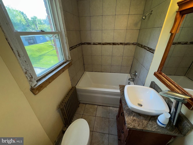 full bath featuring vanity, toilet, radiator heating unit, shower / tub combination, and tile patterned floors