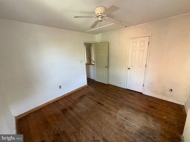 unfurnished bedroom with baseboards, ceiling fan, and wood finished floors