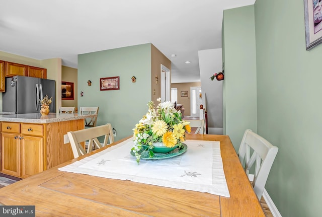 dining space featuring recessed lighting