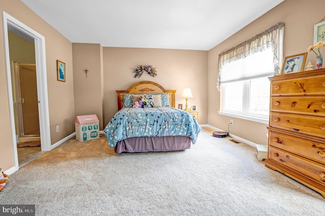 bedroom featuring carpet flooring and baseboards