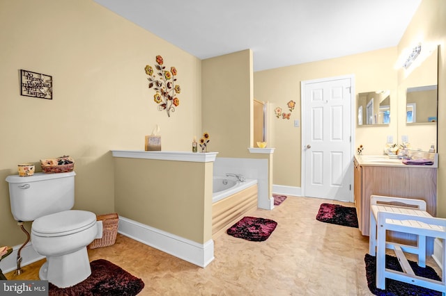 bathroom with a bath, toilet, vanity, baseboards, and tile patterned floors