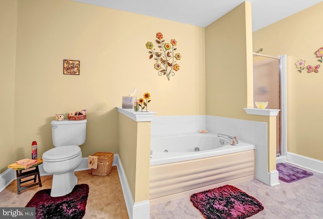 bathroom featuring a stall shower, a whirlpool tub, toilet, and baseboards