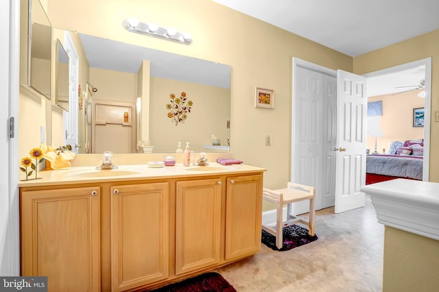 bathroom with double vanity, ensuite bath, a ceiling fan, and tile patterned floors