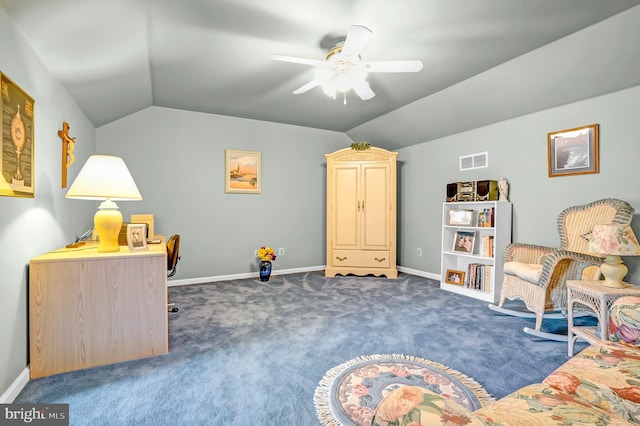 sitting room with carpet, vaulted ceiling, a ceiling fan, and baseboards