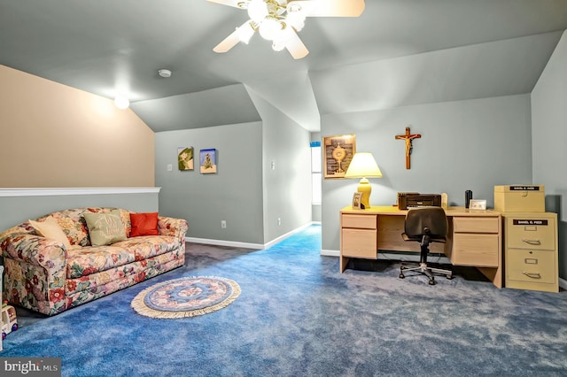 carpeted office with vaulted ceiling, a ceiling fan, and baseboards